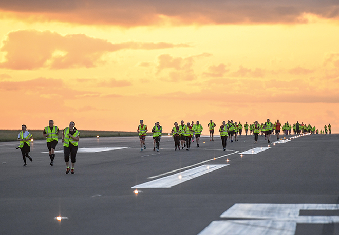 Early risers raise thousands for Macmillan at Runway Race