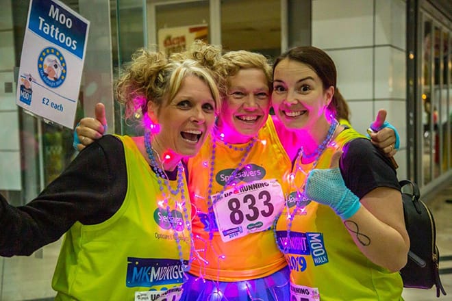 three ladies take part in the Midnight Moo