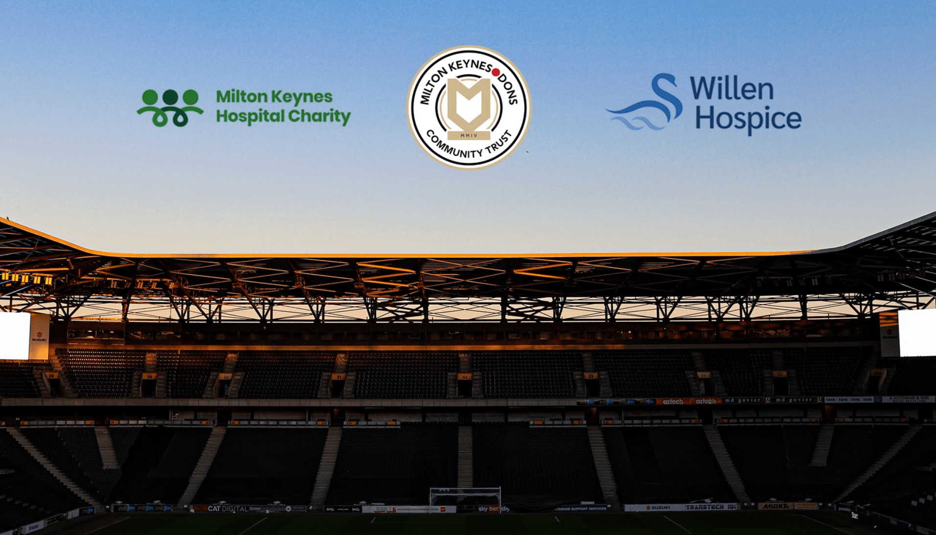 MK Dons Stadium with charity logos