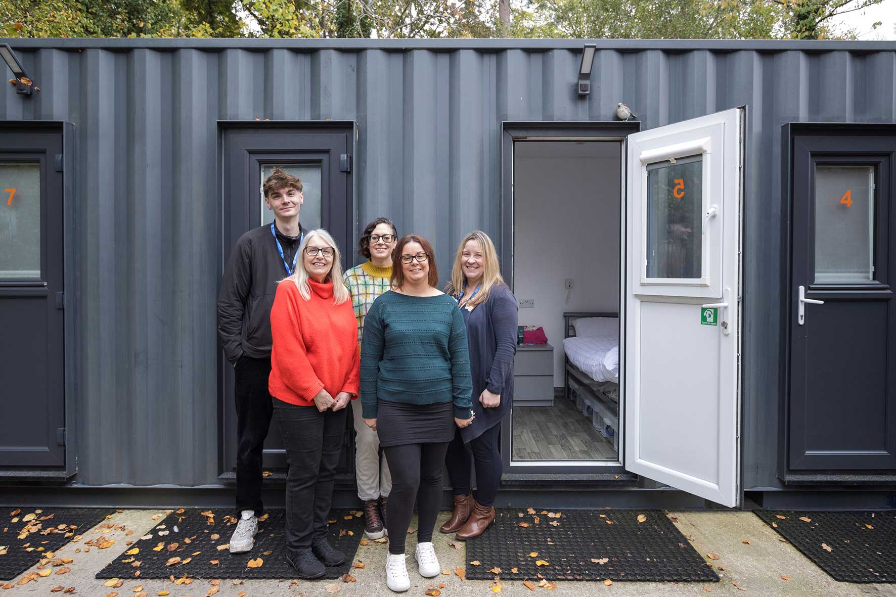 The Shelter MK and Midsummer Place team outside a room at George House.