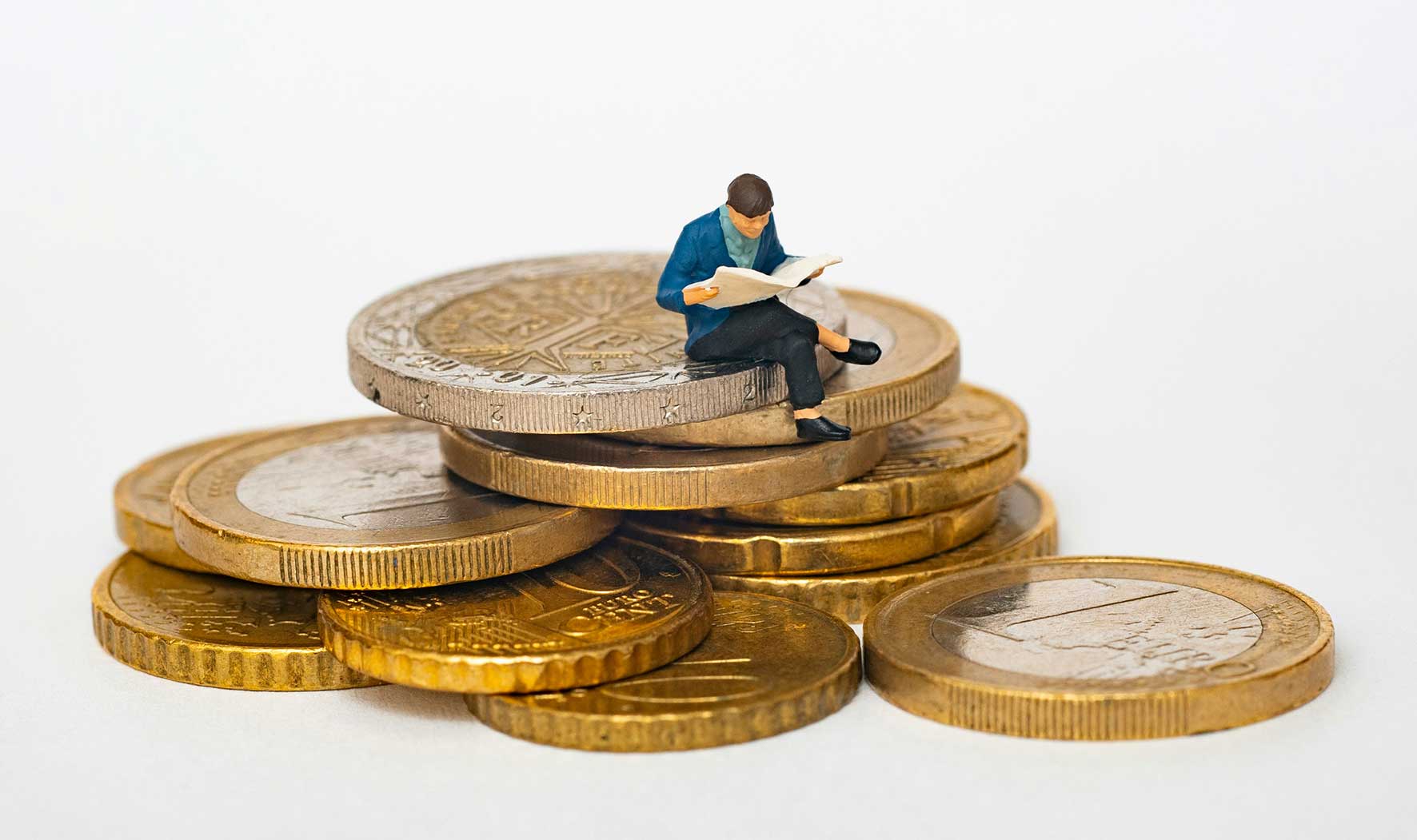 Figure sat on coins