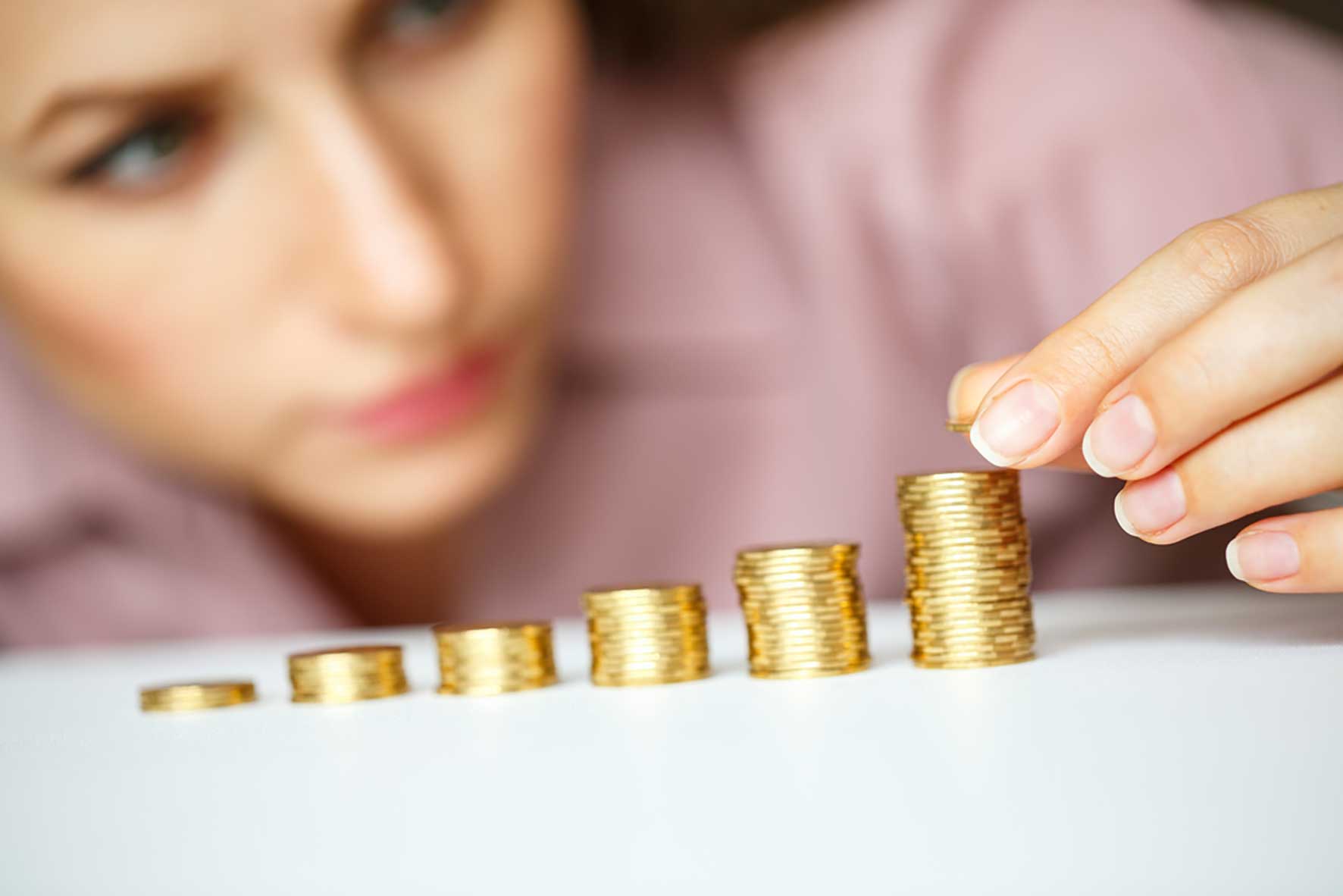 Women stacking coins