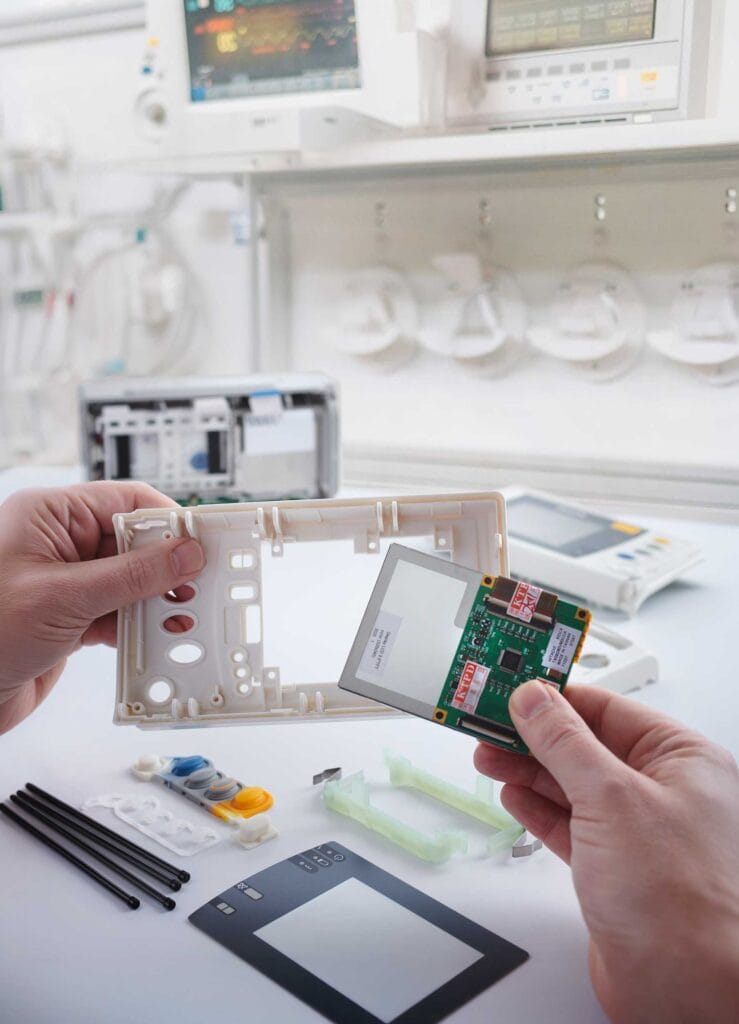Life-Style---Spare-Parts---X2--2 | Business MK Technician inspecting and dismantling medical equipment parts at Tenacore’s Milton Keynes healthcare technology facility.