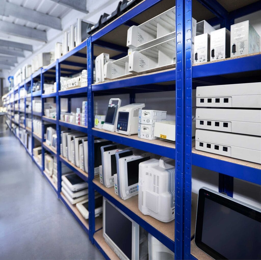 Warehouse---Equipment | Business MK Shelving stocked with medical equipment spare parts at Tenacore’s Milton Keynes healthcare technology facility.