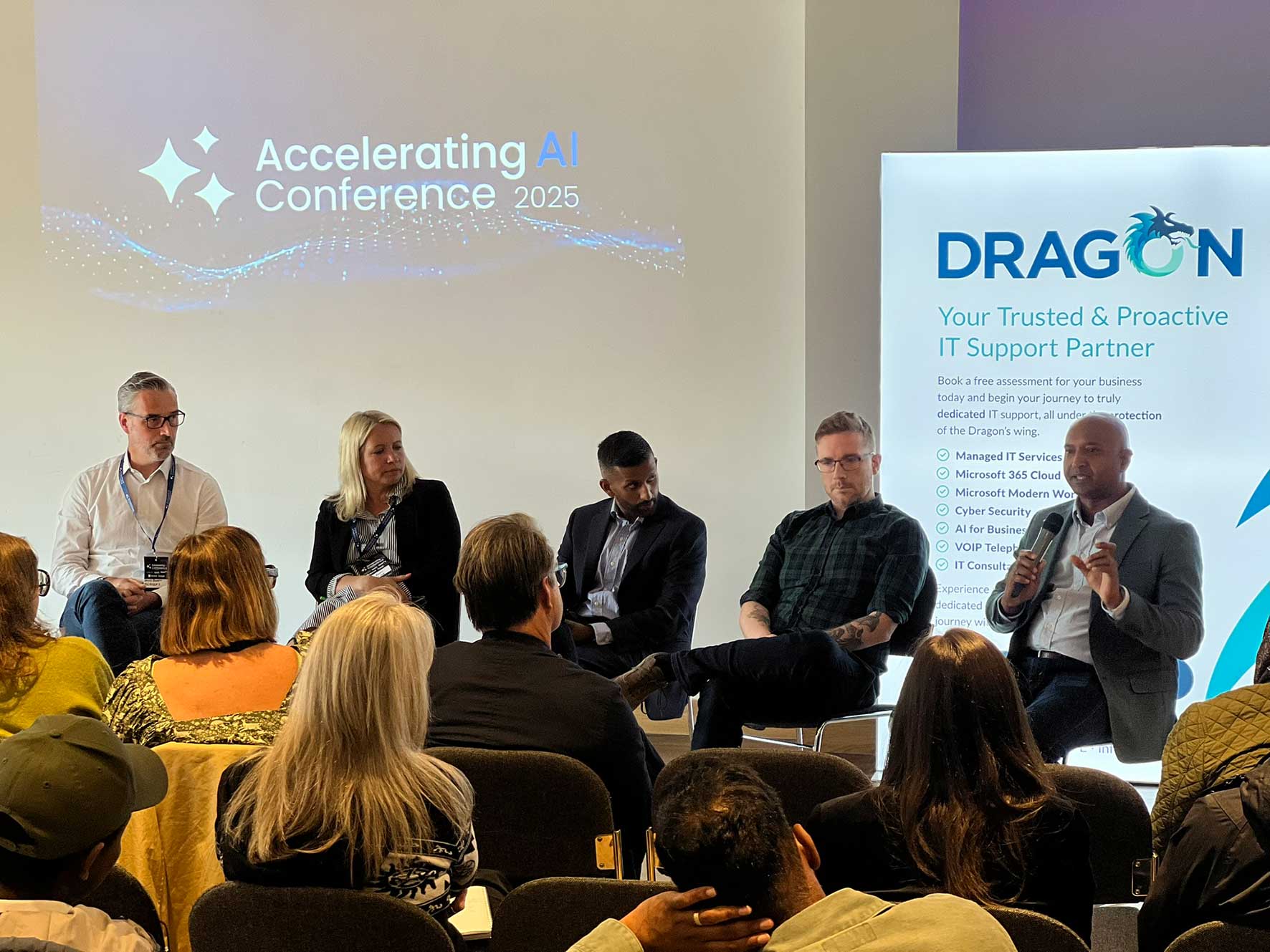 Panel discussion at the Accelerating AI Conference featuring business and technology leaders discussing AI adoption for SMEs