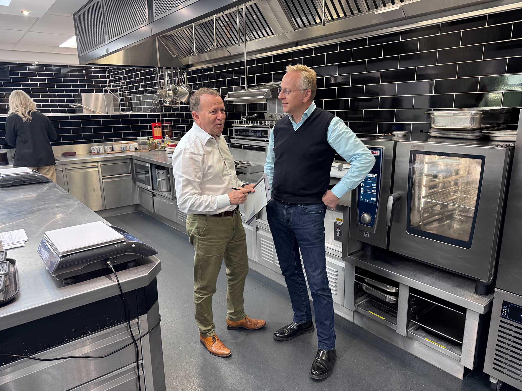 David Hamilton and Freddie Guilmard in discussion at a commercial kitchen during a Leadership in Focus interview
