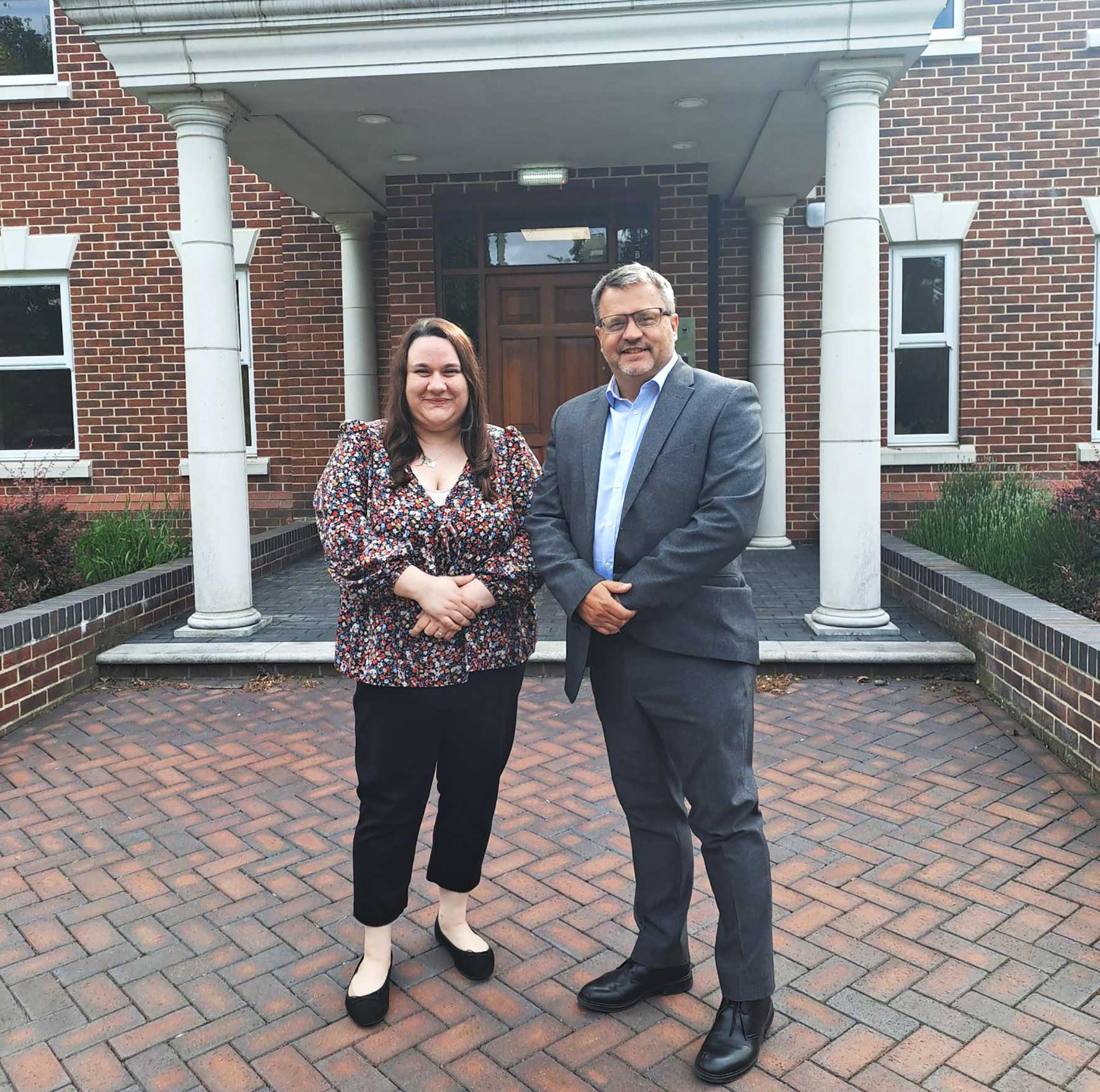 Michelle Gimi and Mike Hayward outside the Woodfines office in Bedford following Michelle's qualification as a solicitor.