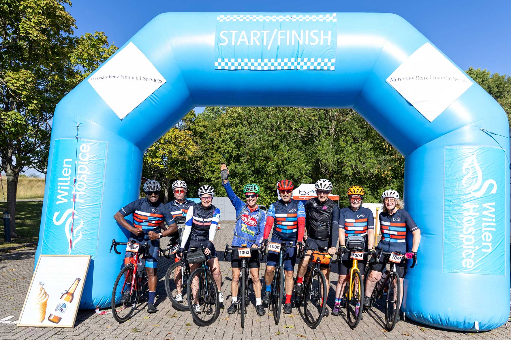 Cyclists gather beneath the Willen Hospice Cycle Sportive start and finish arch before setting off from Milton Keynes.