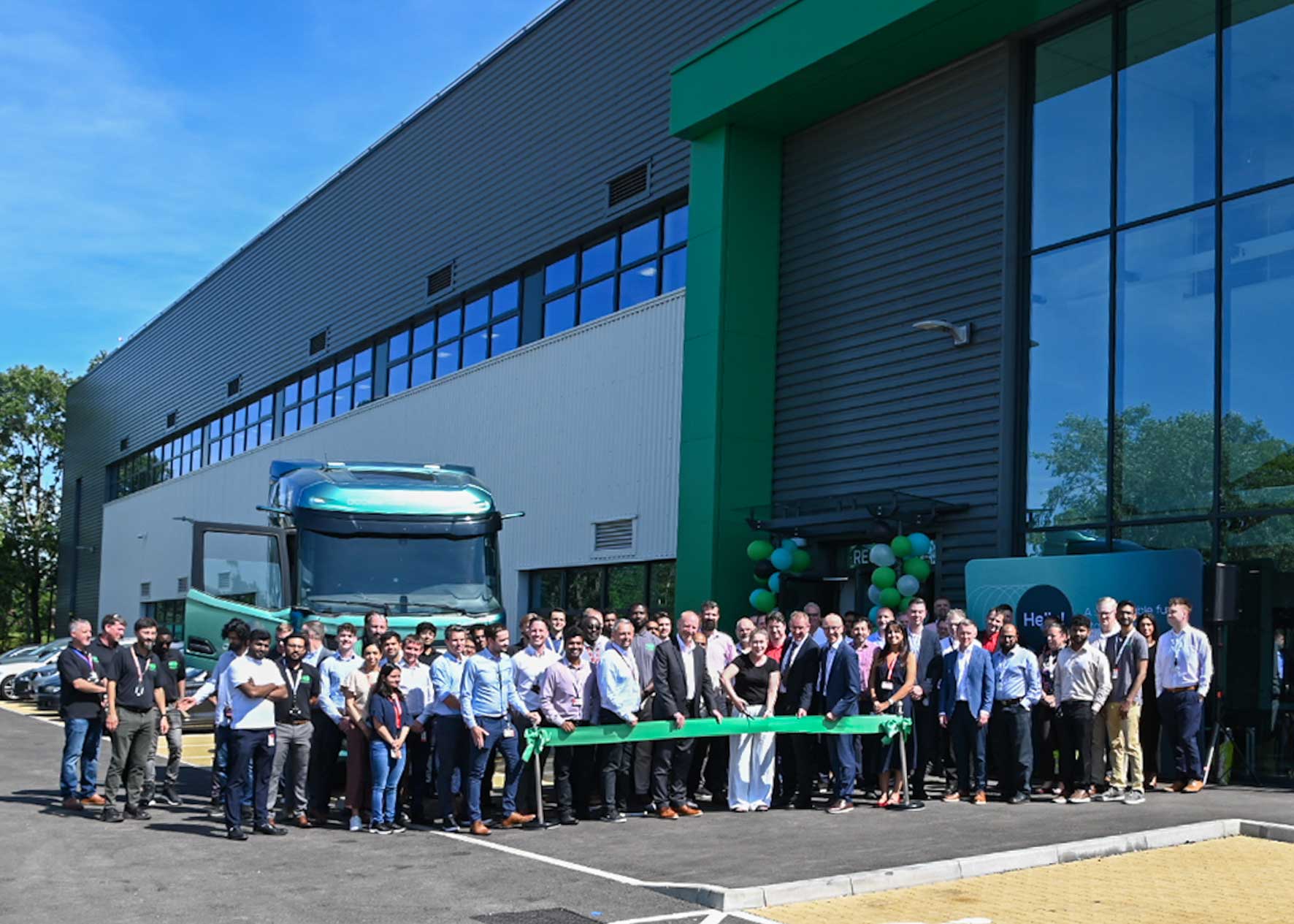 Cummins employees and guests officially open the company's new £10 million battery development facility in Milton Keynes.