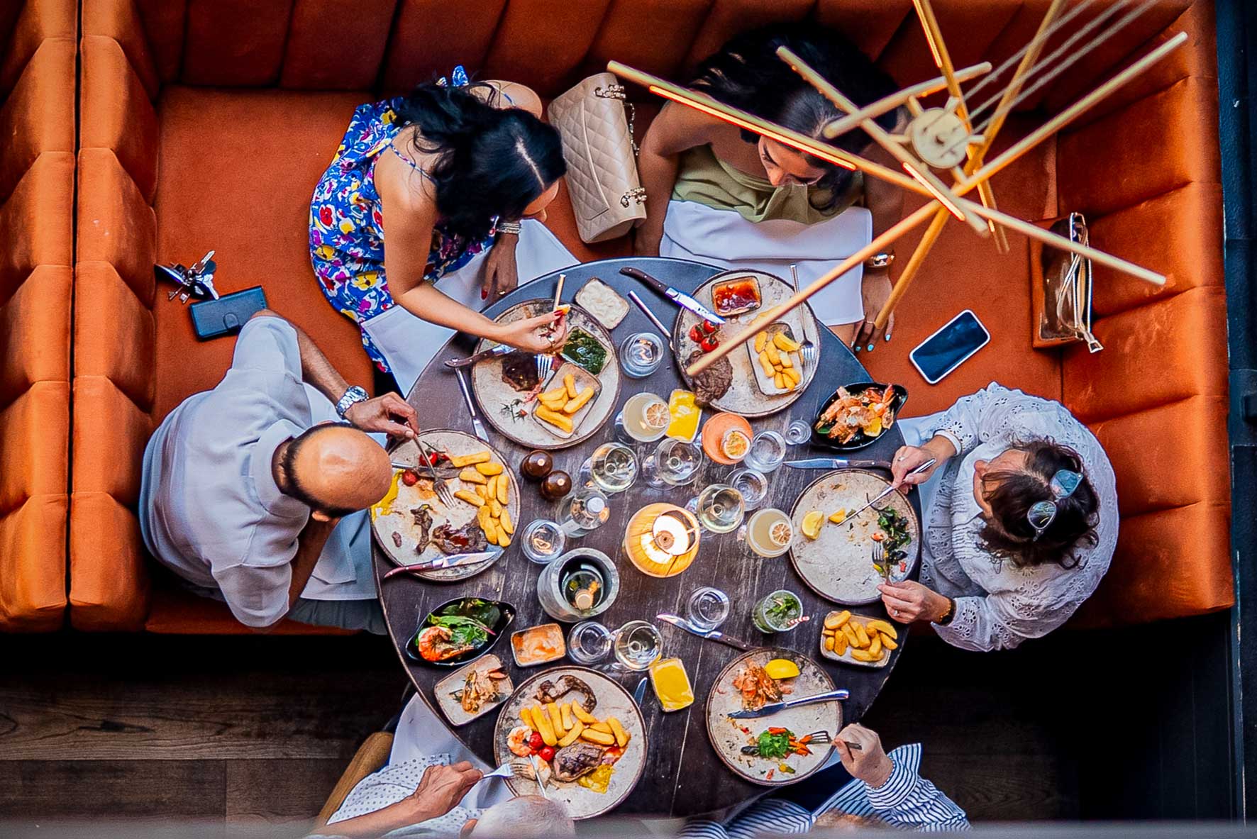 Group of diners sharing a meal at Parrilla restaurant in Milton Keynes